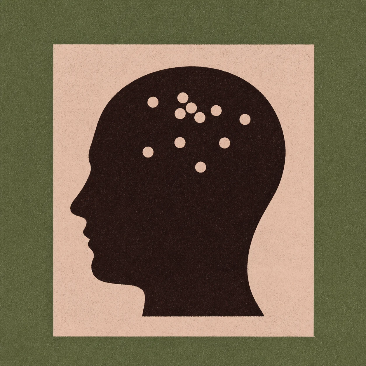 A head silhouette with dots inside